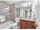 Clean bathroom with tub, shower, and wood vanity at 4202 Caddie E Dr # 102, Bradenton, FL 34203