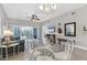 Elegant dining area showcasing a glass table and chandelier at 4202 Caddie E Dr # 102, Bradenton, FL 34203