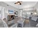 Spacious living room with gray sofa and view of the kitchen and dining area at 4202 Caddie E Dr # 102, Bradenton, FL 34203