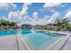 Large community pool with a swim-up bar at 4202 Caddie E Dr # 102, Bradenton, FL 34203