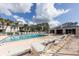 Community pool with lounge chairs and spa at 4202 Caddie E Dr # 102, Bradenton, FL 34203