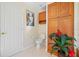 Clean bathroom with toilet and built-in storage at 4512 Spring Flower Ct, Sarasota, FL 34233