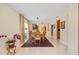 Elegant dining room with a wooden table and rich colored rug at 4512 Spring Flower Ct, Sarasota, FL 34233