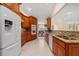 Modern kitchen featuring granite countertops and stainless steel appliances at 4512 Spring Flower Ct, Sarasota, FL 34233