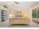 Comfortable main bedroom with pool view and lots of natural light at 4512 Spring Flower Ct, Sarasota, FL 34233