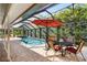 Expansive pool and patio area with seating for dining at 4512 Spring Flower Ct, Sarasota, FL 34233