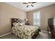 Guest bedroom with ceiling fan and large closet at 4608 Halls Mill Xing, Ellenton, FL 34222