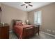 Cozy bedroom with ceiling fan and ample closet space at 4608 Halls Mill Xing, Ellenton, FL 34222