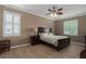 Large bedroom with wood flooring and a ceiling fan at 4608 Halls Mill Xing, Ellenton, FL 34222