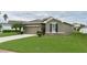 Green house exterior with a two-car garage at 4608 Halls Mill Xing, Ellenton, FL 34222