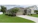 House exterior view, two-car garage, palm trees at 4608 Halls Mill Xing, Ellenton, FL 34222