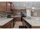 Modern kitchen with dark cabinets and tile backsplash at 4608 Halls Mill Xing, Ellenton, FL 34222