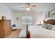 Main bedroom with king-size bed, wood furniture, and plantation shutters at 4826 Maymont Park Cir, Bradenton, FL 34203