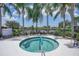 Relax in the community hot tub, surrounded by palm trees at 4826 Maymont Park Cir, Bradenton, FL 34203