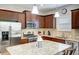 Modern kitchen with granite island and stainless steel appliances at 4826 Maymont Park Cir, Bradenton, FL 34203