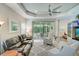 Relaxing living room with leather sectional sofa and hardwood floors at 4826 Maymont Park Cir, Bradenton, FL 34203