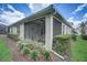 Spacious screened patio with seating area, perfect for relaxing outdoors at 4826 Maymont Park Cir, Bradenton, FL 34203