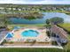 Community pool with surrounding landscaping at 5007 Elmhurst Ln, Palmetto, FL 34221