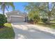 Gray house with two-car garage and driveway at 5007 Elmhurst Ln, Palmetto, FL 34221