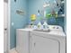 Bright laundry room with washer and dryer at 5007 Elmhurst Ln, Palmetto, FL 34221