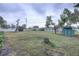 Large backyard with shed and grassy area at 5117 6Th Avenue W Dr, Bradenton, FL 34209