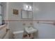 Clean bathroom with pink tile and a single sink vanity at 5117 6Th Avenue W Dr, Bradenton, FL 34209