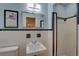 Small bathroom with black and white tile, updated vanity and shower at 5117 6Th Avenue W Dr, Bradenton, FL 34209