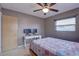 Bedroom with ceiling fan, window blinds, and built-in desk at 5117 6Th Avenue W Dr, Bradenton, FL 34209