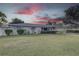 Landscaped lawn and single story home with a light gray exterior at 5117 6Th Avenue W Dr, Bradenton, FL 34209