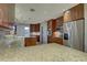 Spacious kitchen with granite countertops and wood cabinets at 5117 6Th Avenue W Dr, Bradenton, FL 34209