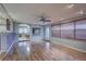 Spacious living room featuring hardwood floors and a view into the kitchen at 5117 6Th Avenue W Dr, Bradenton, FL 34209