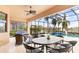 Covered patio with seating area and pool view at 5133 Cantabria Crst, Sarasota, FL 34238