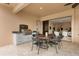 Outdoor kitchen and dining area on a covered patio at 5133 Cantabria Crst, Sarasota, FL 34238