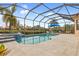 Inviting screened-in pool and spa, perfect for relaxation at 5133 Cantabria Crst, Sarasota, FL 34238