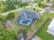 Aerial view showcasing a single-Gathering home and private pool in a quiet neighborhood at 5375 Joslyn Ter, Port Charlotte, FL 33981