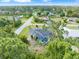 Aerial view of a single-Gathering home with a pool in a residential neighborhood at 5375 Joslyn Ter, Port Charlotte, FL 33981