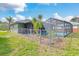 Spacious backyard with fenced pool and lush landscaping at 5375 Joslyn Ter, Port Charlotte, FL 33981