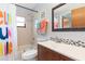 Clean bathroom with shower/tub combo, vanity, and colorful accents at 5375 Joslyn Ter, Port Charlotte, FL 33981