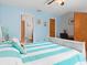 Spacious bedroom with light wood furniture and en-suite bathroom at 5375 Joslyn Ter, Port Charlotte, FL 33981