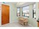 Charming kitchen nook with glass-top table and wicker chairs at 5375 Joslyn Ter, Port Charlotte, FL 33981