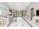 Living room with white furniture, tiled floor, and view of pool at 5375 Joslyn Ter, Port Charlotte, FL 33981