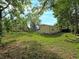 Overiew of a vast backyard with lush greenery and trees offering privacy and tranquility at 5411 9Th E St, Bradenton, FL 34203