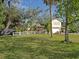 Charming two-story home with a well-manicured lawn, white picket fence and attached two-car garage at 5411 9Th E St, Bradenton, FL 34203