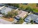 Aerial view showing house, pool, and surrounding neighborhood at 5687 Milton Ave, Sarasota, FL 34243