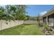 Backyard with fenced-in grassy area at 5687 Milton Ave, Sarasota, FL 34243