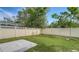 Large backyard with grassy lawn and patio at 5687 Milton Ave, Sarasota, FL 34243