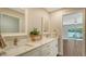 Modern bathroom with double vanity and quartz countertops at 5687 Milton Ave, Sarasota, FL 34243