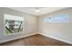 Spacious bedroom with large window and tile floors at 5687 Milton Ave, Sarasota, FL 34243