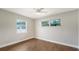 Simple bedroom with tile floors and large window at 5687 Milton Ave, Sarasota, FL 34243