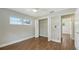 Well-lit bedroom with tile floors and closet at 5687 Milton Ave, Sarasota, FL 34243